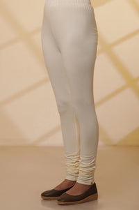 Cream Solid Plain Skinny Cotton Churidar
