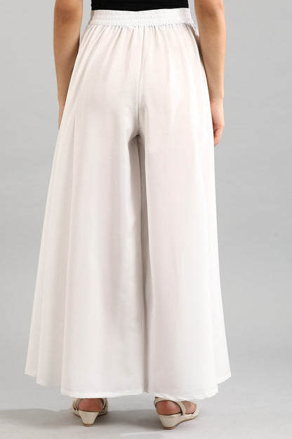 White solid palazzos