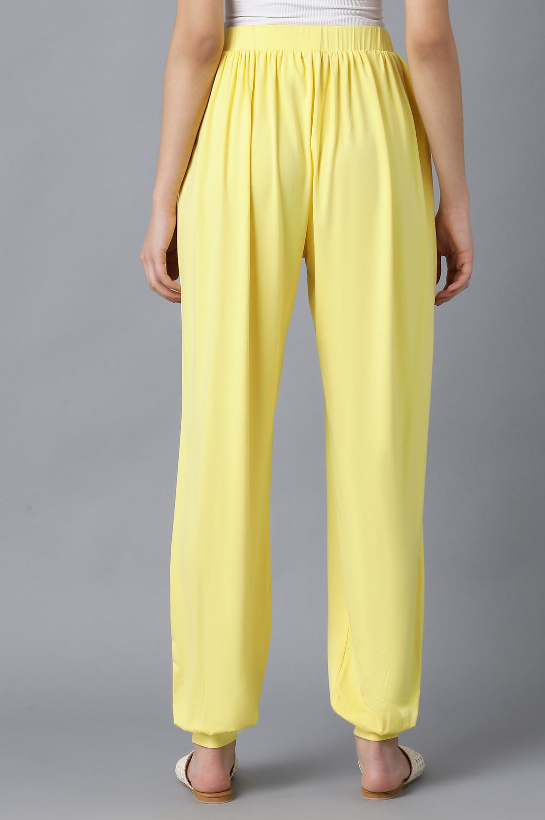 Yellow Solid Flared Pants With Elasticated Waist