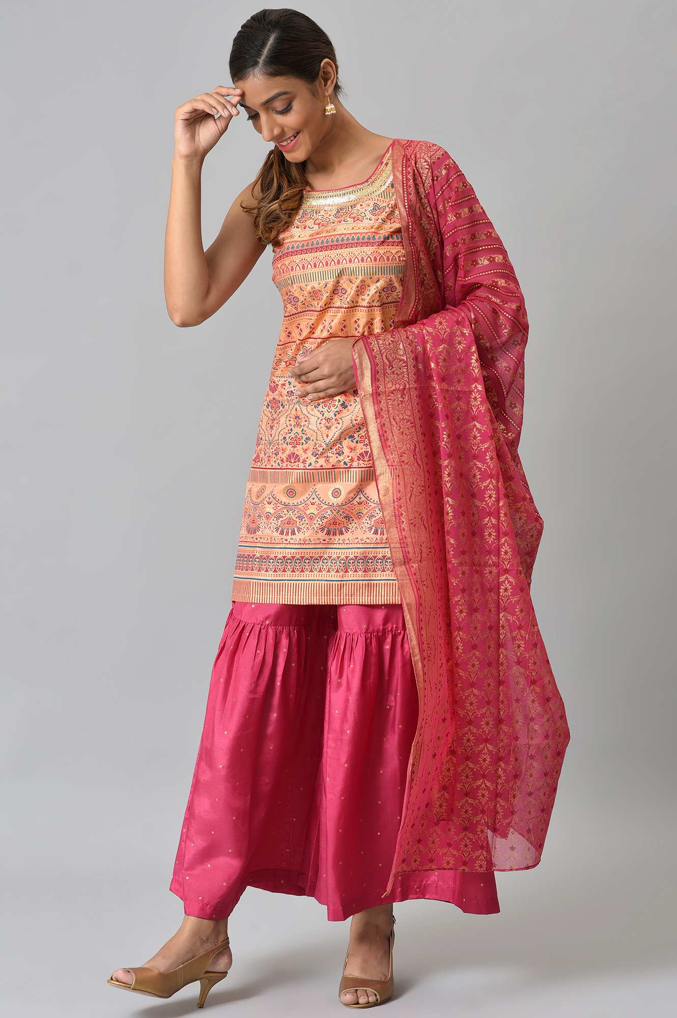 Peach Foil Printed Sleeveless kurta with Pink Sharara and Dupatta