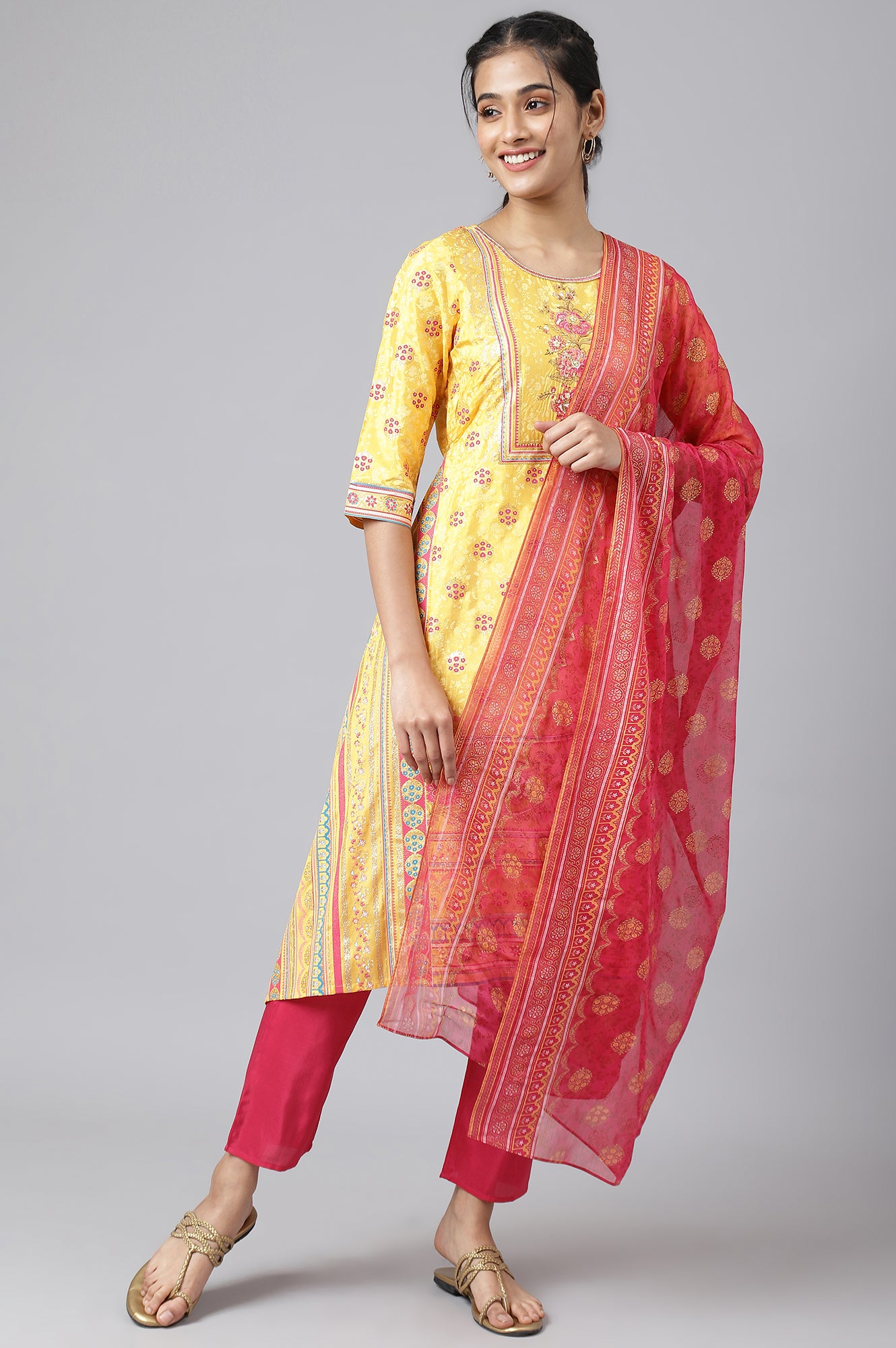 Liva Yellow Asymmetric Kurta With Pink Trouser And Dupatta