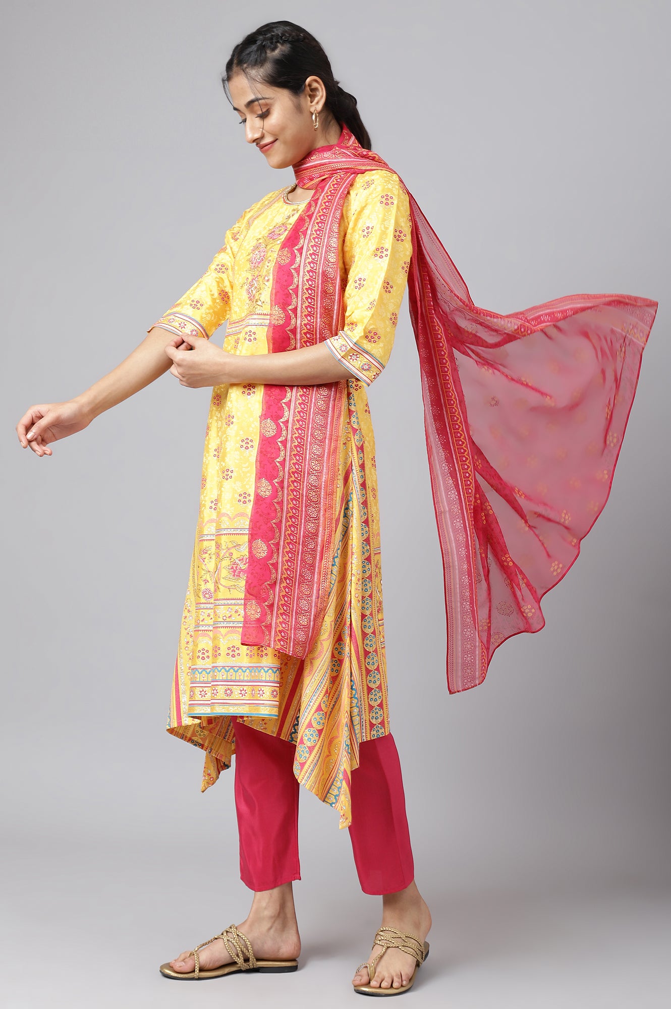 Yellow Asymmetric kurta with Pink Trouser and Dupatta