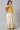 Girls Yellow Printed Sleeveless Top With White Printed Skirt And Dupatta