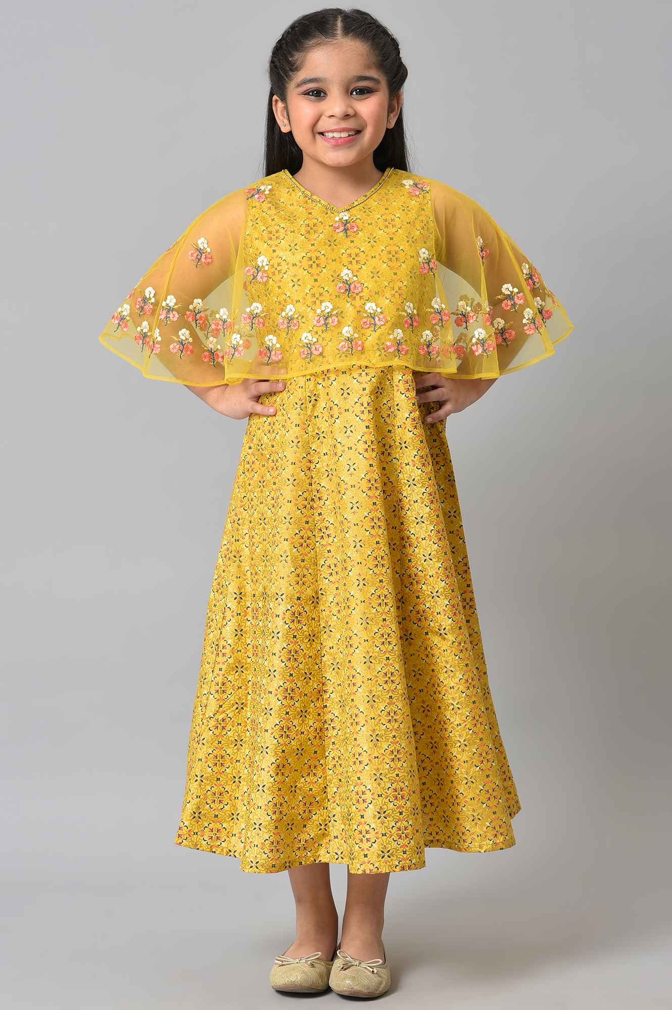 Girls Yellow Dress With Net Layered Cape