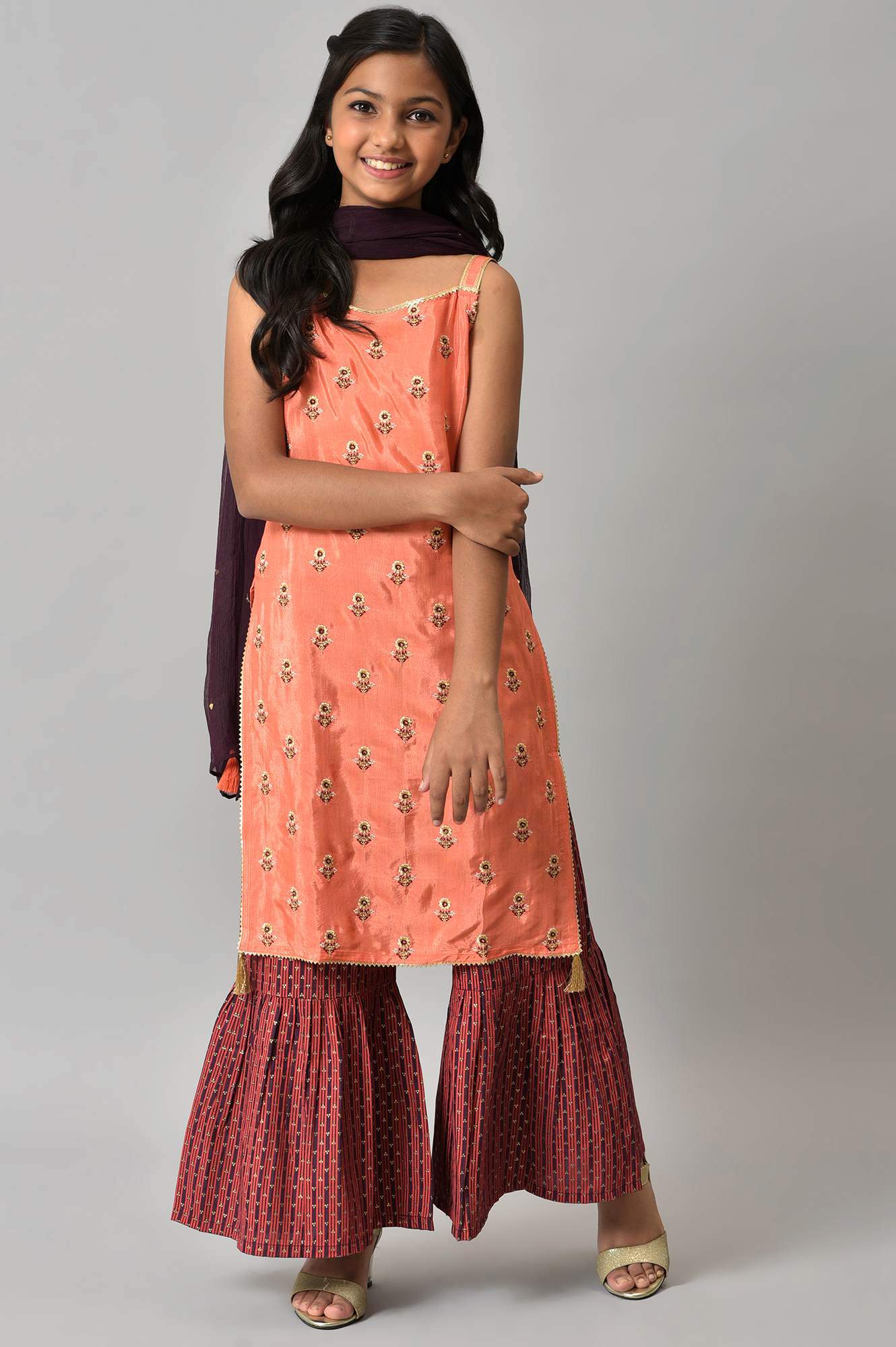 LIVA Girls Orange Embroidered kurta with Purple Sharar and Dupatta