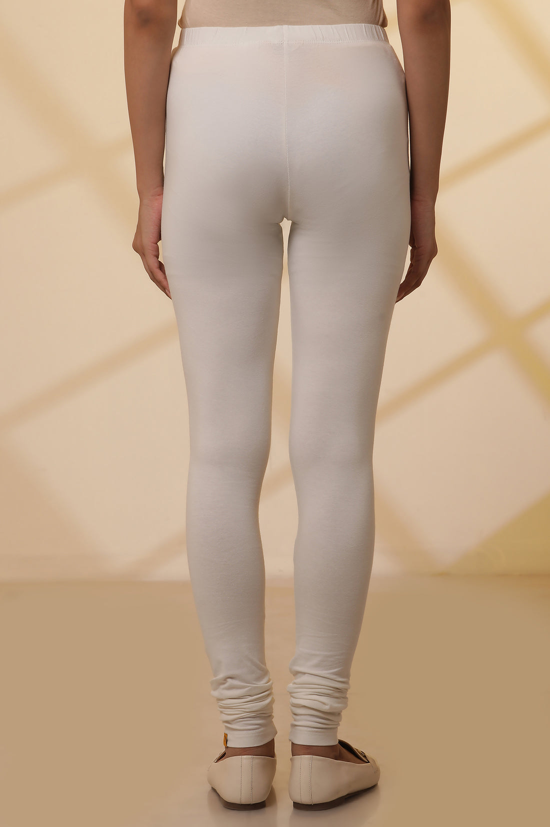 Off-White Solid Ankle Length Cotton Lycra Churidar