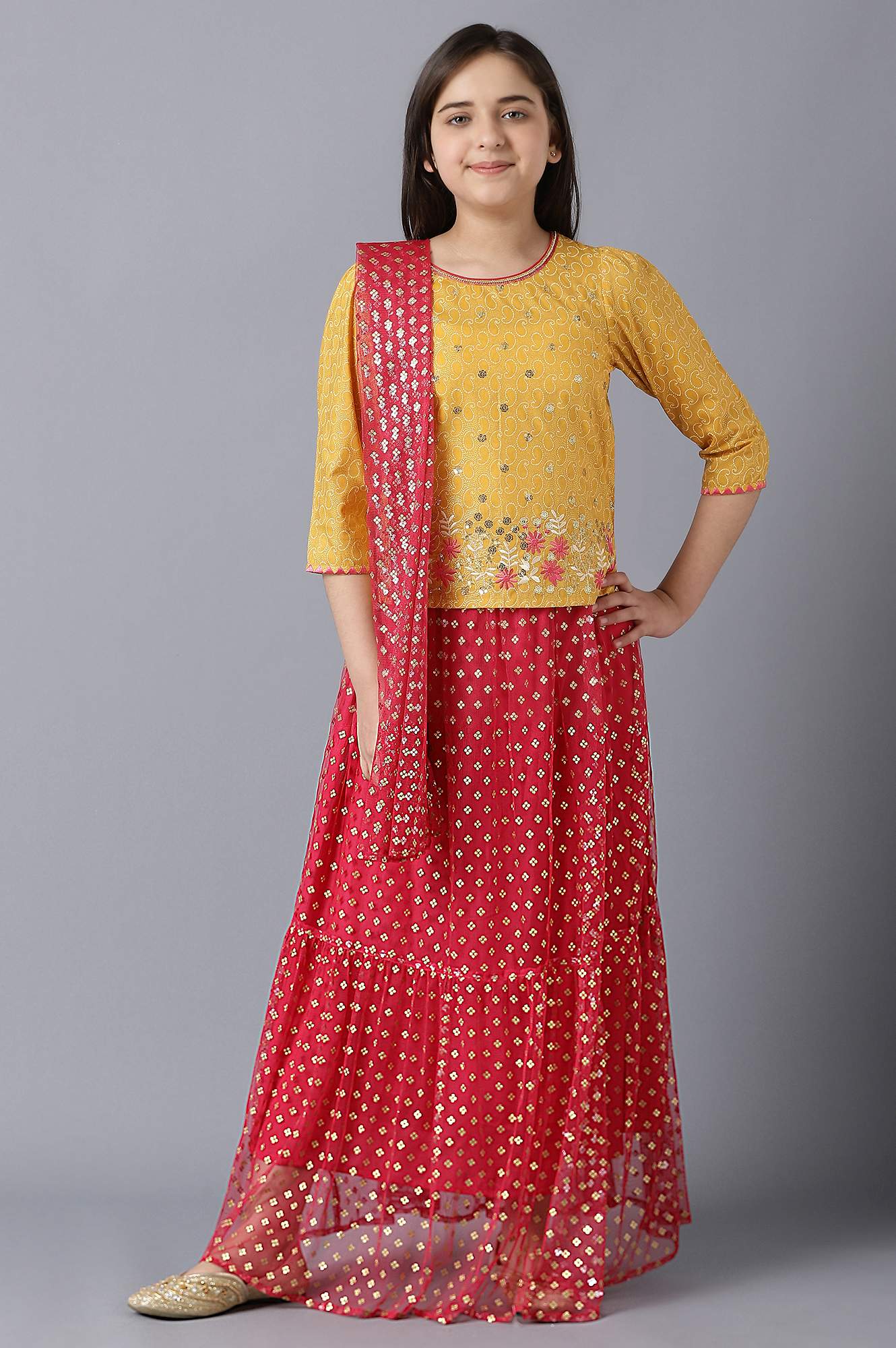 Girls Yellow Foil Printed Top With Red Flared Skirt And Dupatta