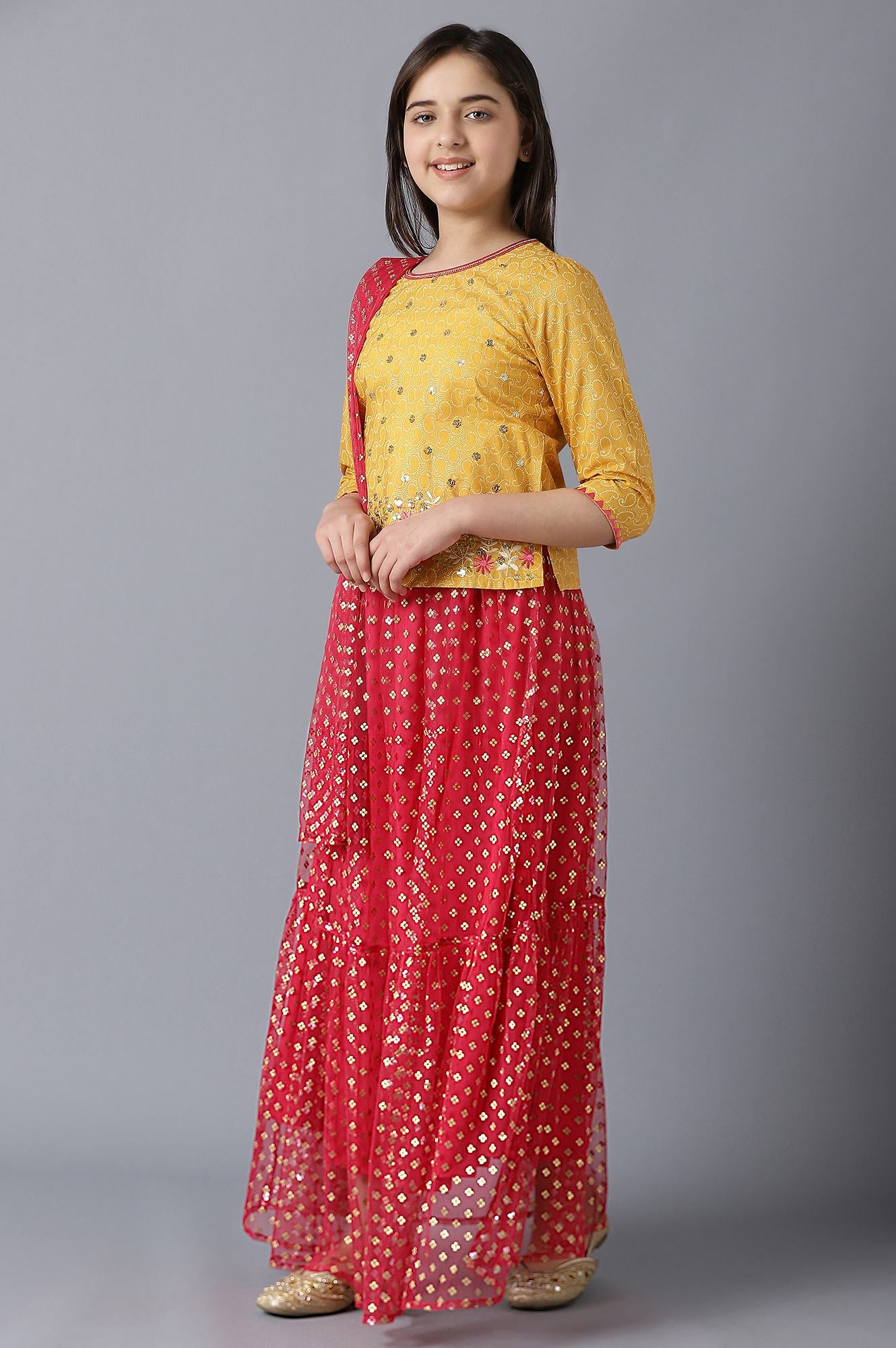 Girls Yellow Foil Printed Top With Red Flared Skirt And Dupatta