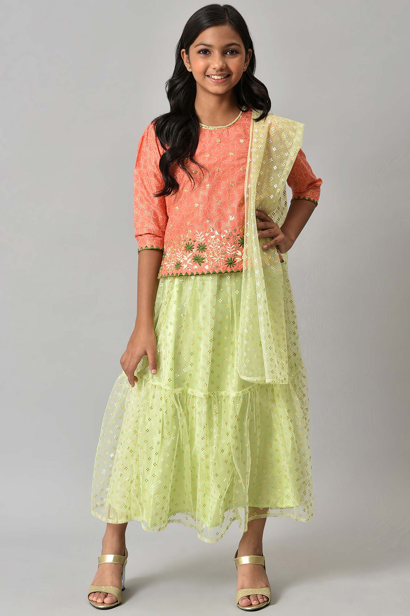 Girls Orange Foil Printed Top With Green Flared Skirt And Dupatta