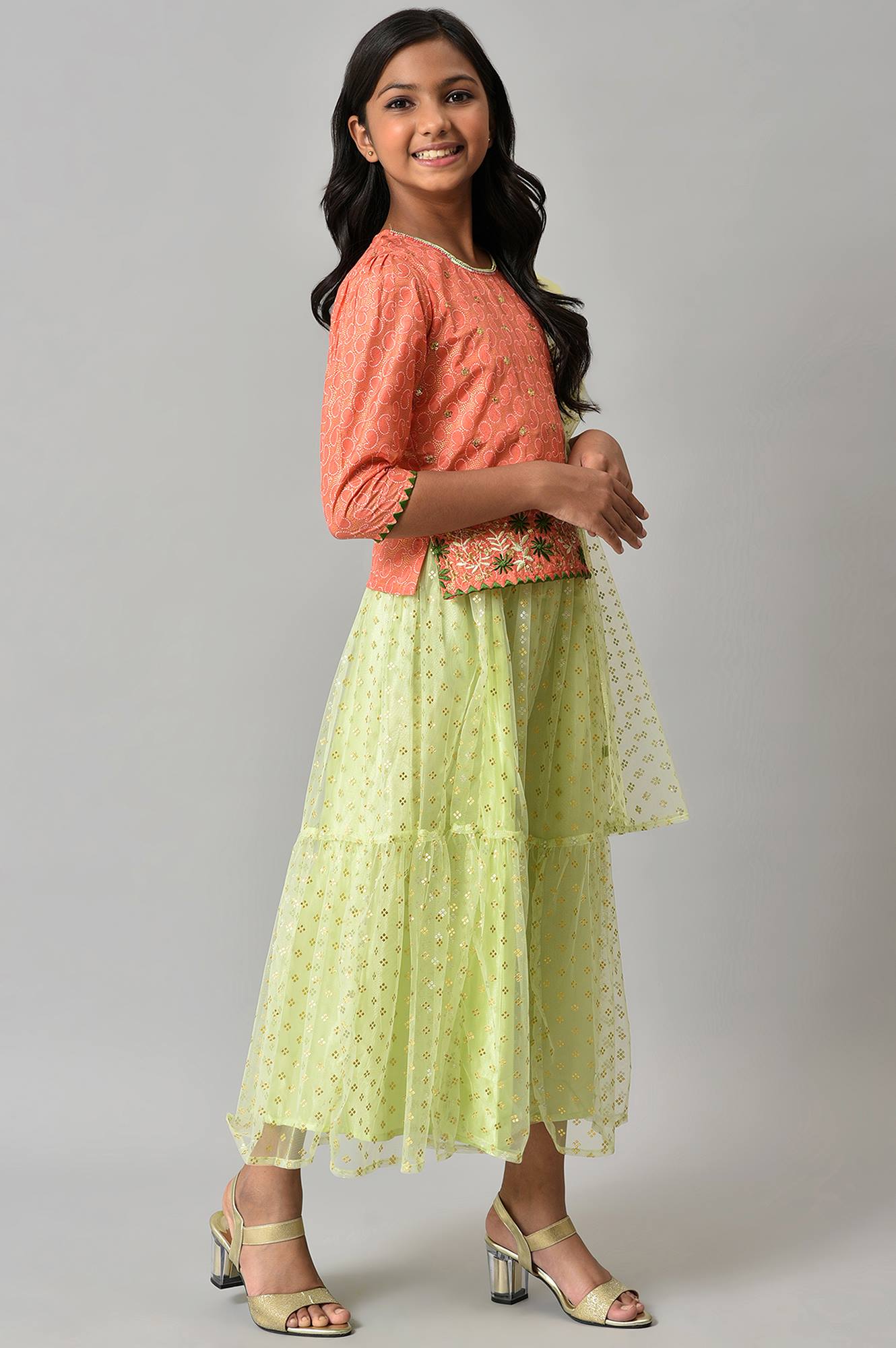 Girls Orange Foil Printed Top With Green Flared Skirt And Dupatta