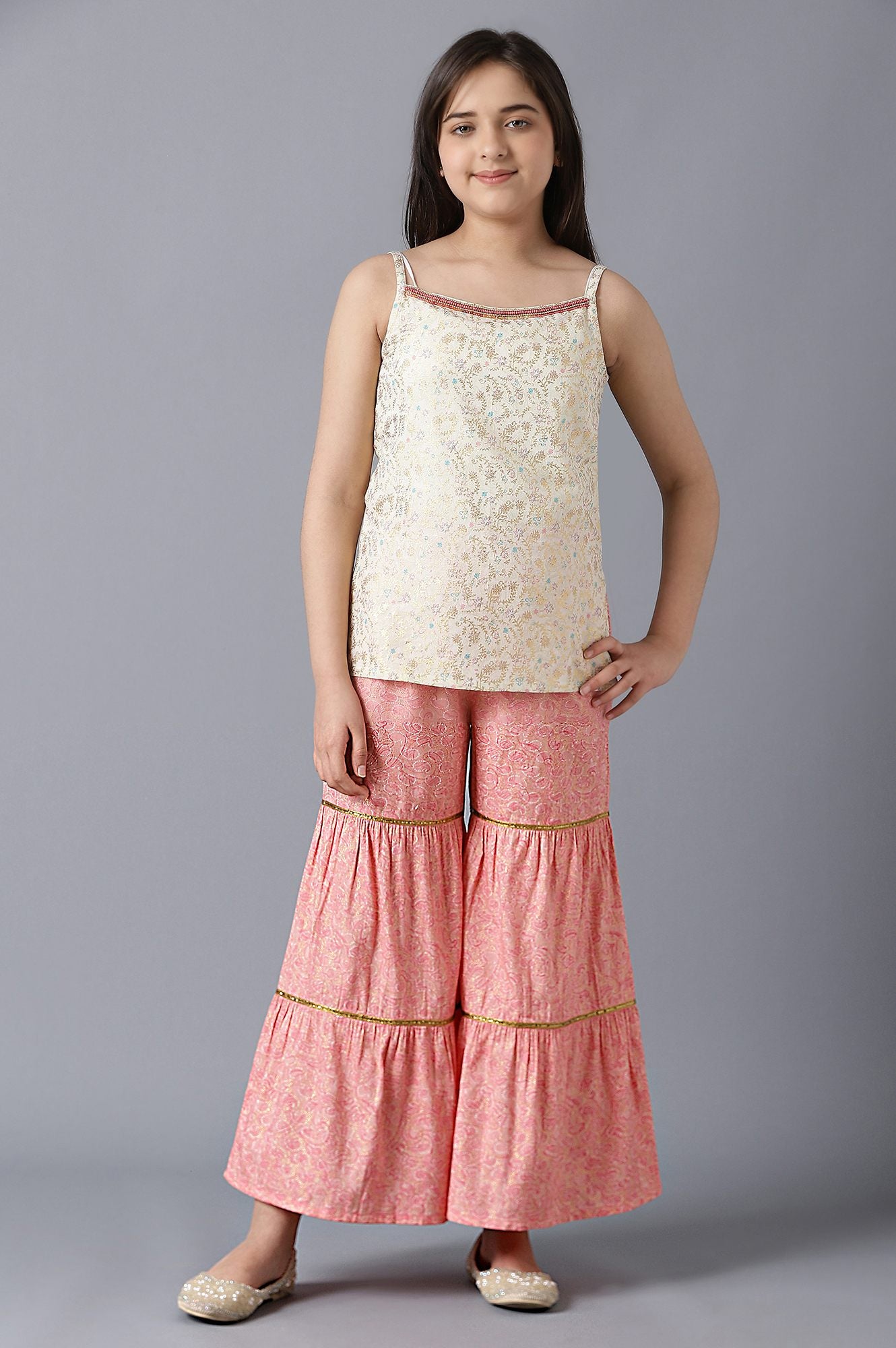 Girls Pink Foil Printed Gillet With Sleeveless White kurta And Pink Flared Skirt