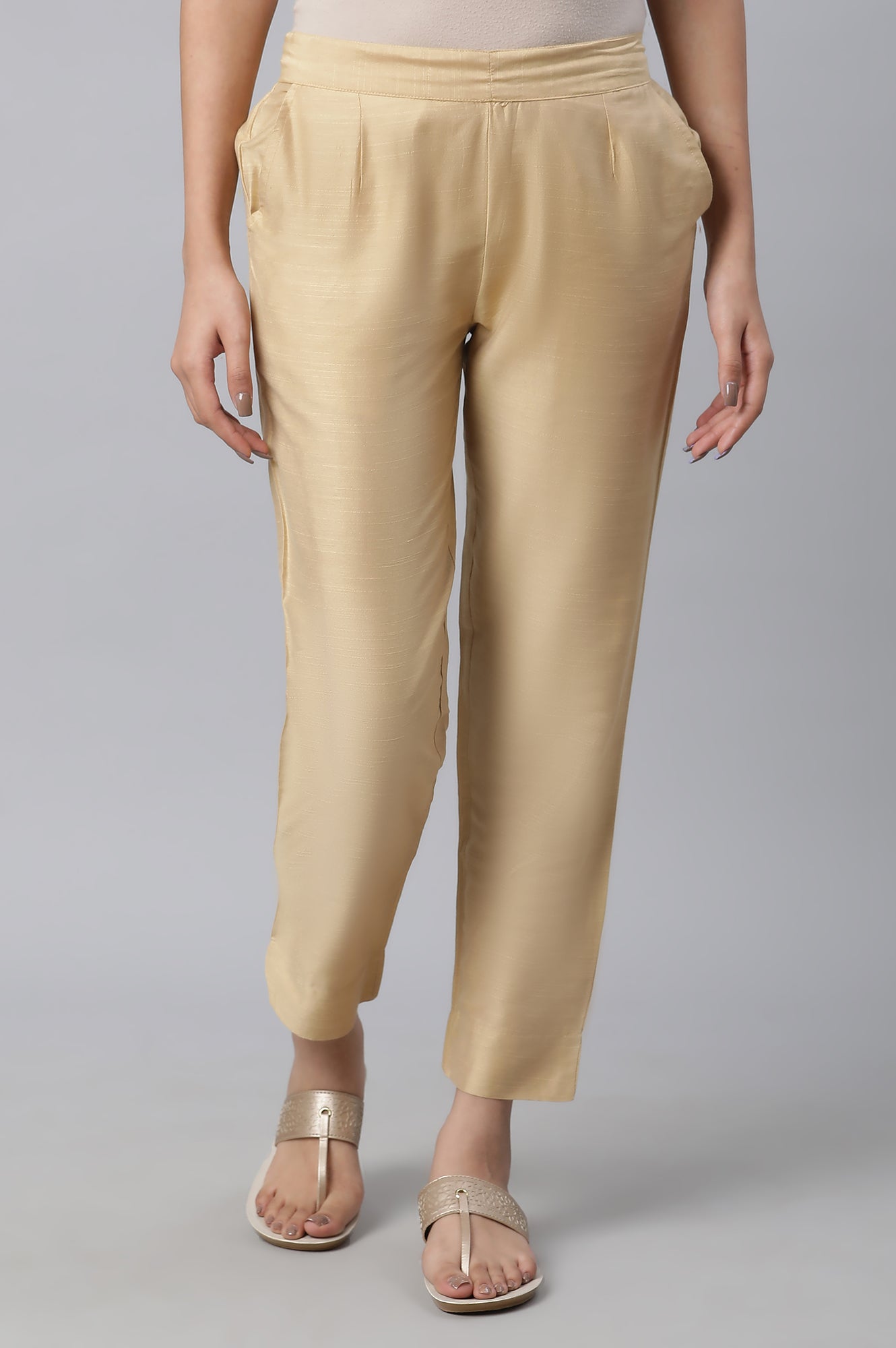 Gold Soild Ankle Length Trousers in Mid-Rise