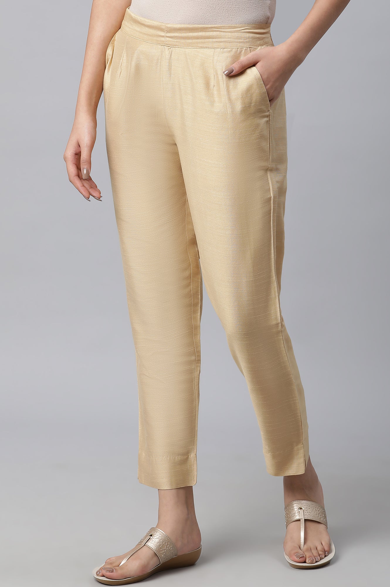 Gold Soild Ankle Length Trousers in Mid-Rise