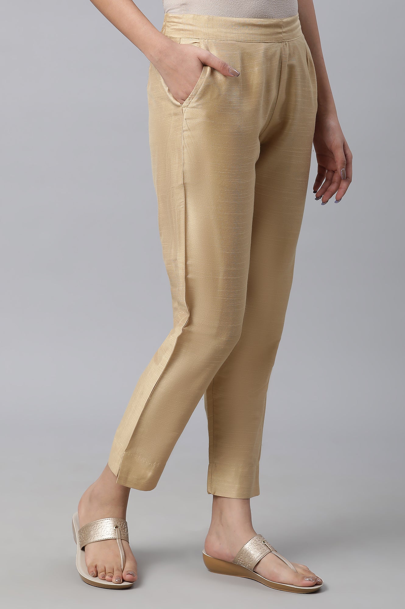 Gold Soild Ankle Length Trousers in Mid-Rise