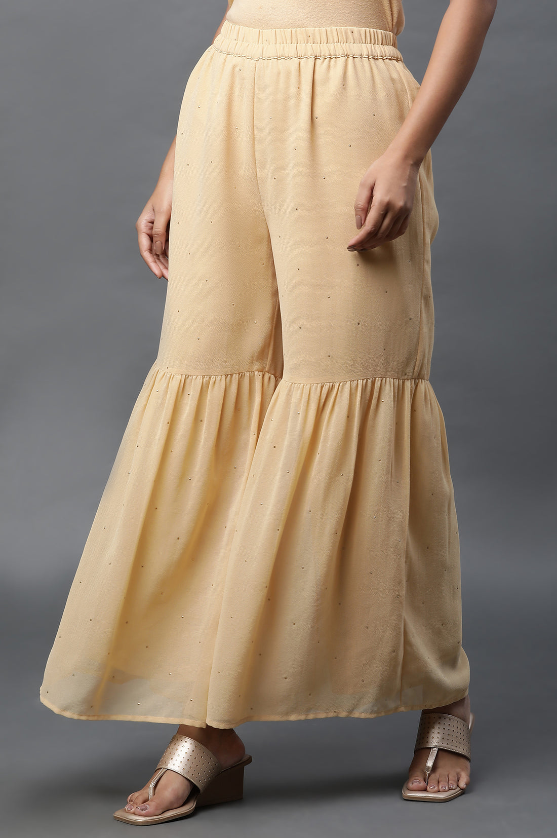 Gold Polka Dots Printed Flared Woven Palazzo With Elasticated Waist