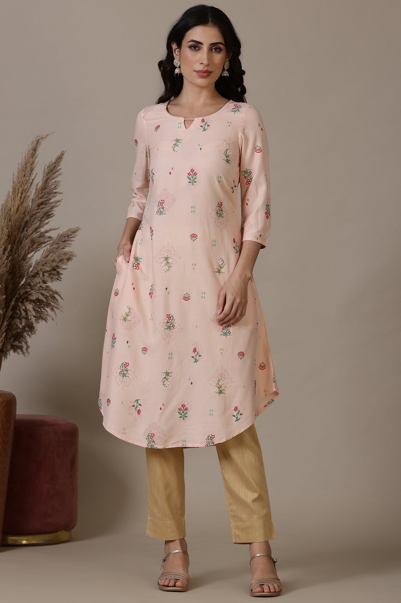 Light Peach Foil Floral Printed A line Rayon Kurta with Curved Hemline