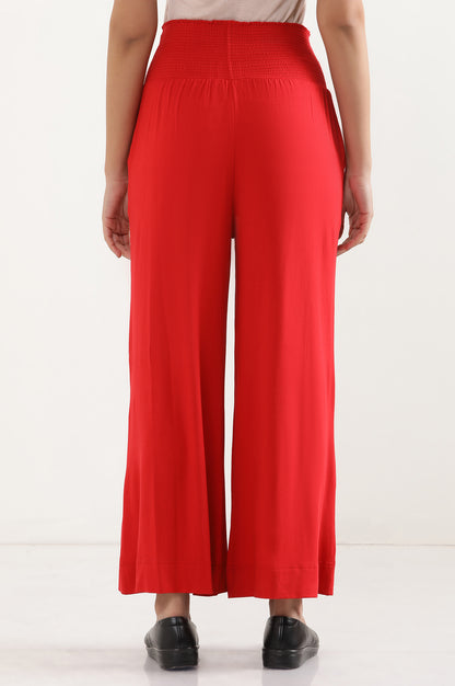 Red Flared Pants with Smoked Waistbelt