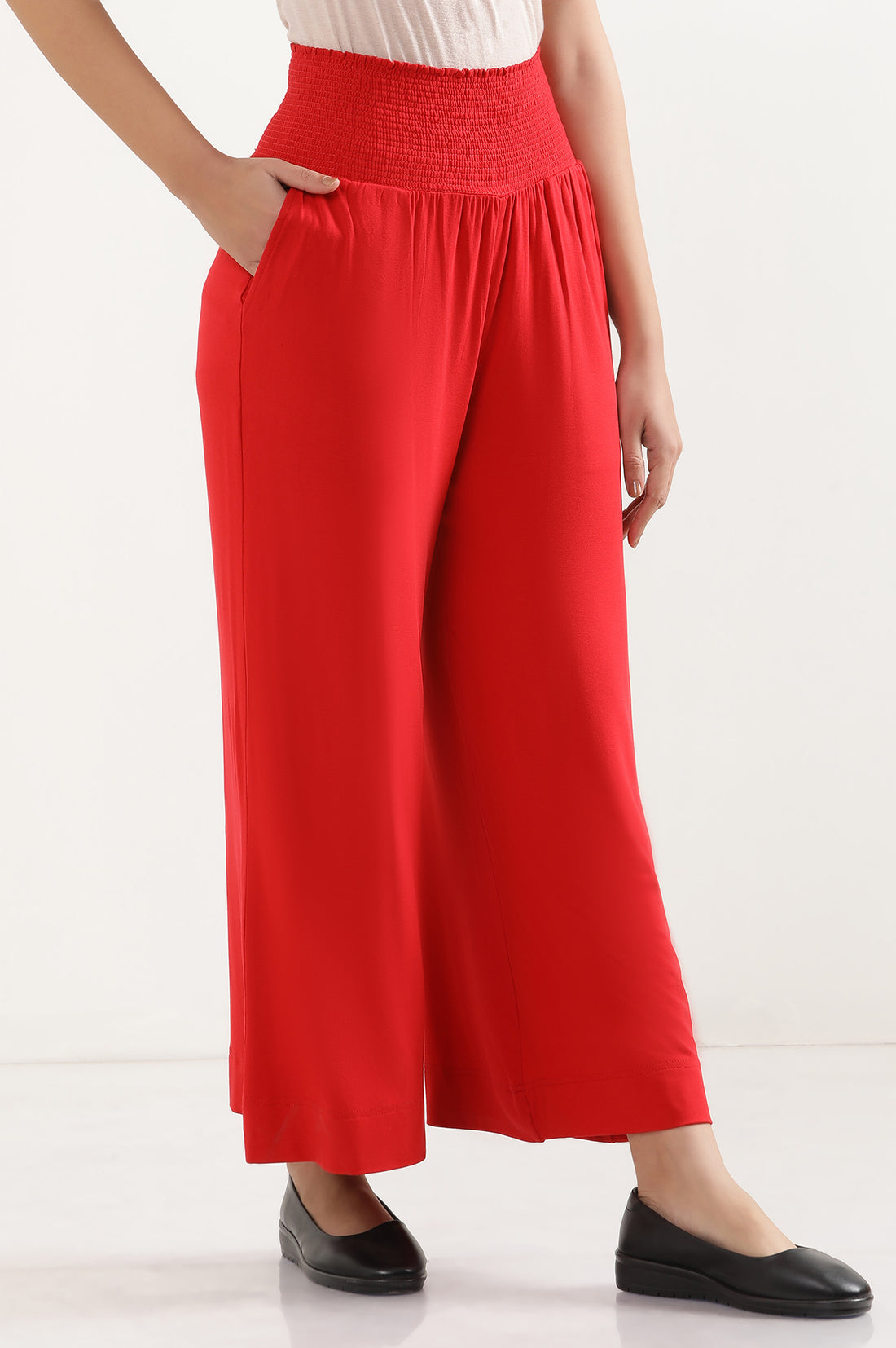 Red Solid Flared Pants With Smocked Waistbelt