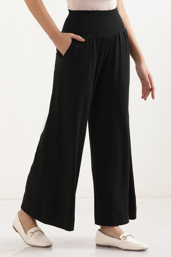 Elleven Women's Black Solid Flared Pants With Smocked Waistbelt