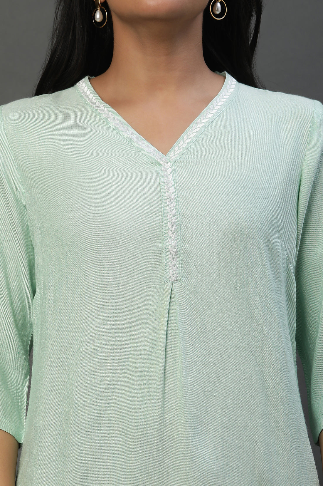 Green Causal Kurti with Embroidery on Neck