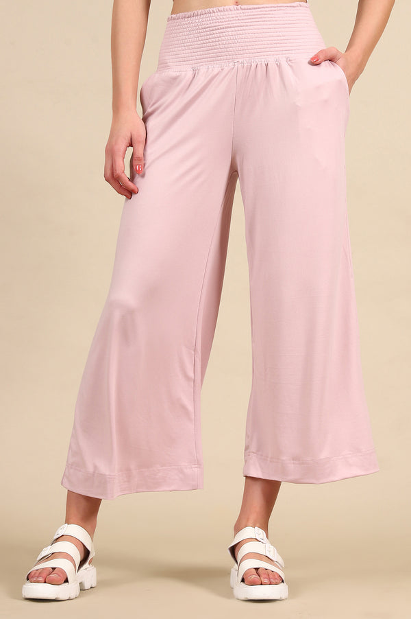 Elleven Women's Pink Solid Flared Pants With Smoked High Waisted Detail