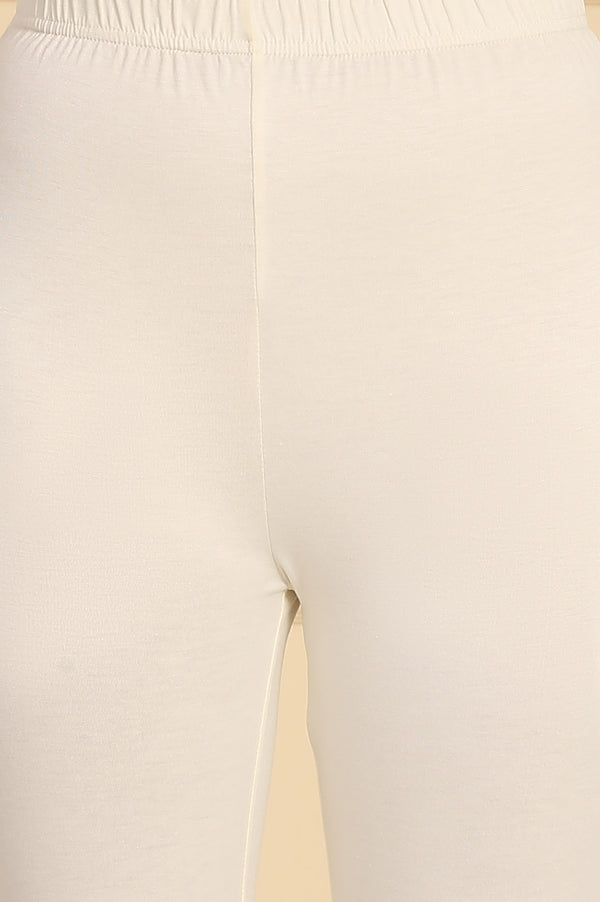 Cream Solid Schiffli Embroidered Flared Kurta, Leggings and Dupatta Set