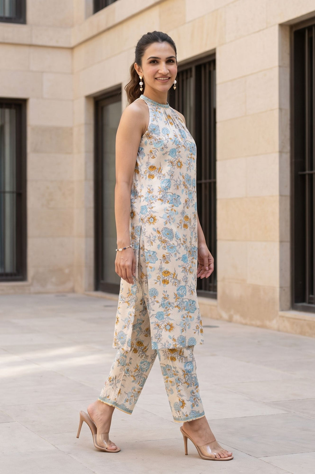 Beige Floral Print Pure Cotton Straight Calf Length Sleeveless Halter Neck Kurta with Ankle Length Straight Fit Trousers (Set of 2)